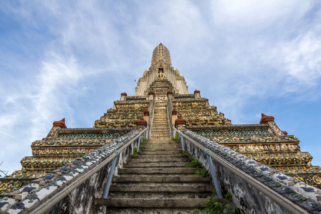Wat Arun Looking from the bottom of the steps which lead up to the 82m-high þrahng at Wat Arun, Bangkok.