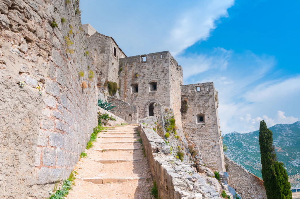 Klis Fortress A huge stone fortification at the top of a steep, narrow path