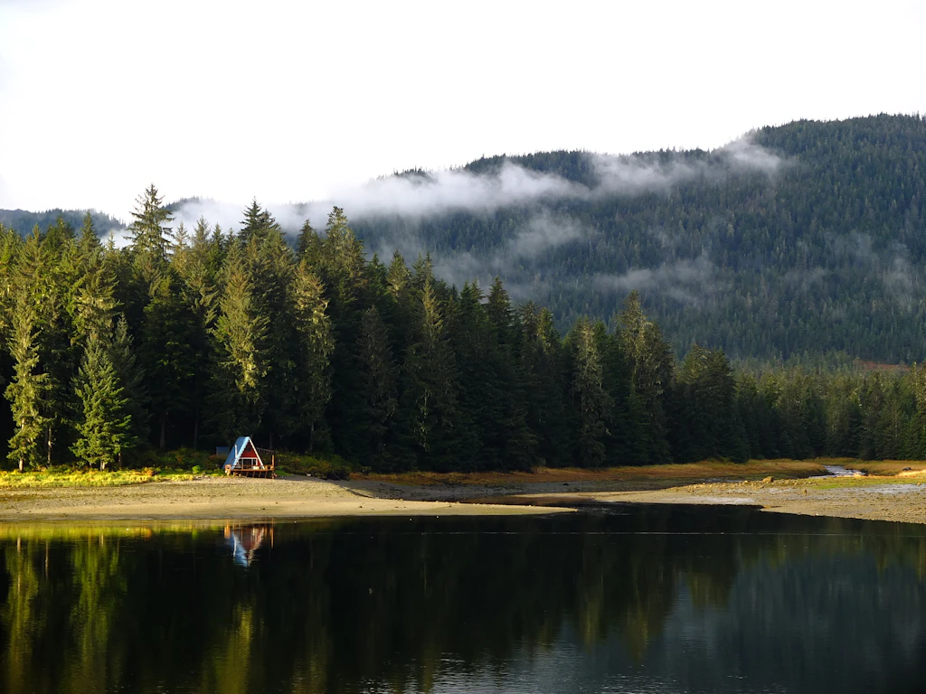 Remote cabin on the edge of a lake in the Tongass National Forest, Alaska