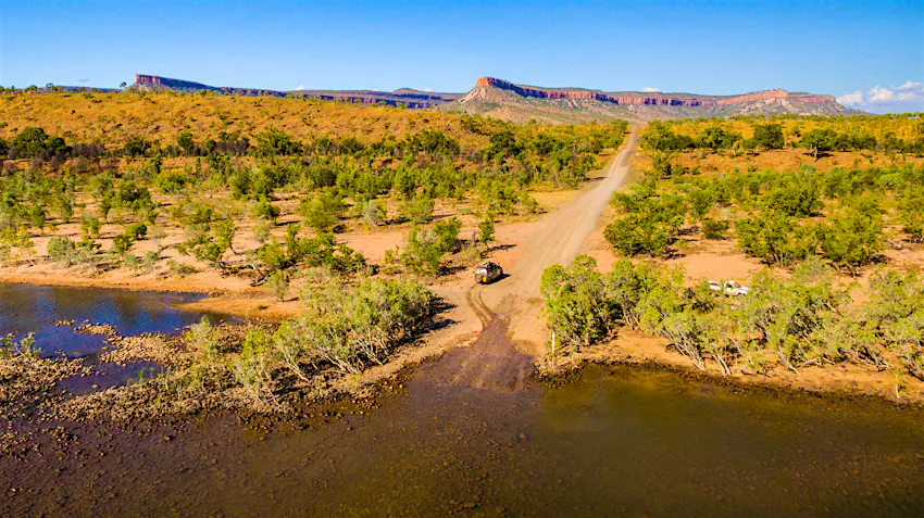 road-trip-australia-gibb-river-road.jpg a van driviing the isolated Pentecost River Crossing on Gibb River Road