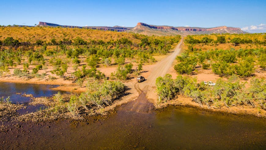 a van driviing the isolated Pentecost River Crossing on Gibb River Road