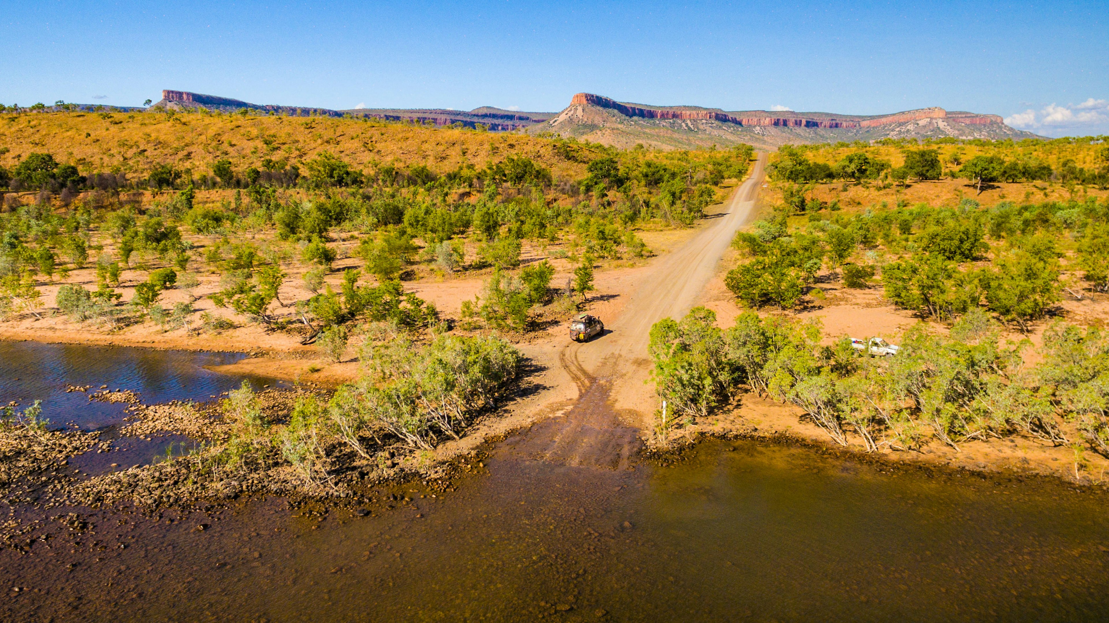 a van driviing the isolated Pentecost River Crossing on Gibb River Road