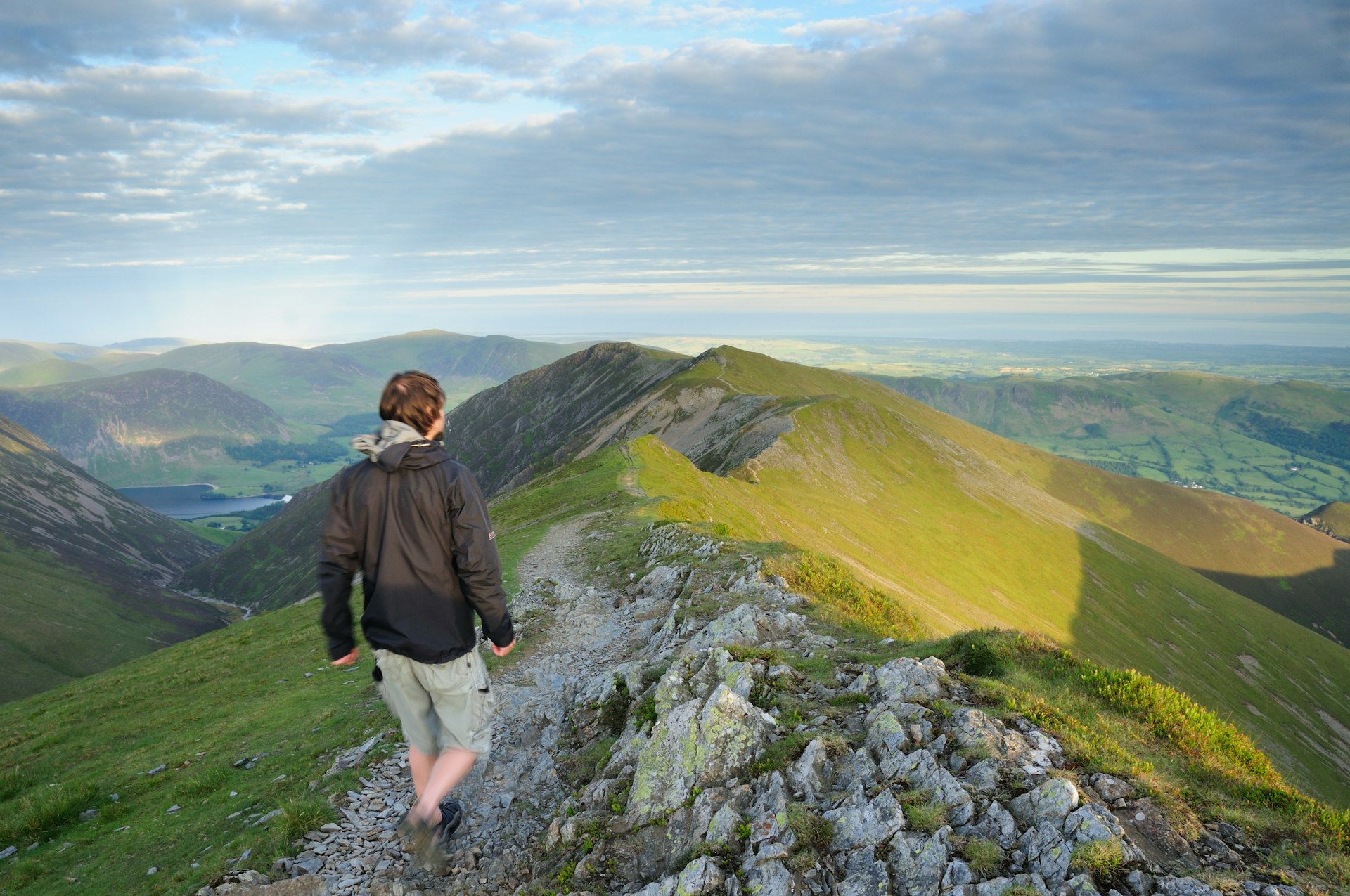Walker on Whiteside above Gasgale Crags in the English Lake District