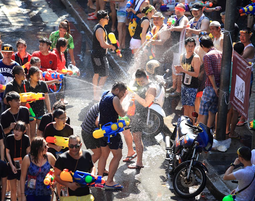 Tourists shooting water pistols at Songkran festival in Bangkok 