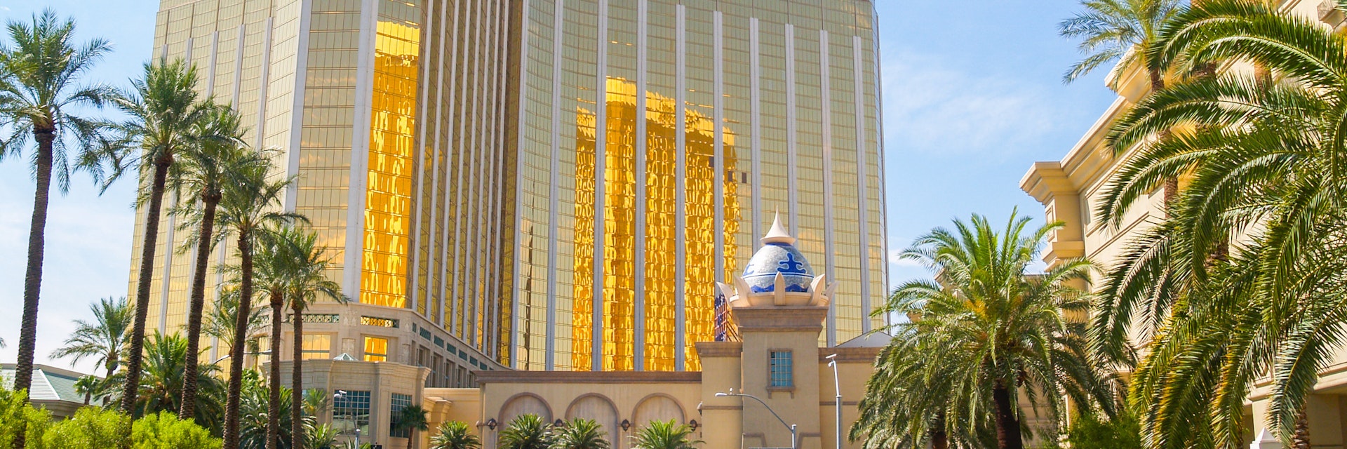 LAS VEGAS, USA AUGUST 14; Enormous Mandalay Bay Hotel Resort and Casino with beautifully landscaped entrance to modern architectural gold glass facade of building August 14, 2008, Las Vegas, USA