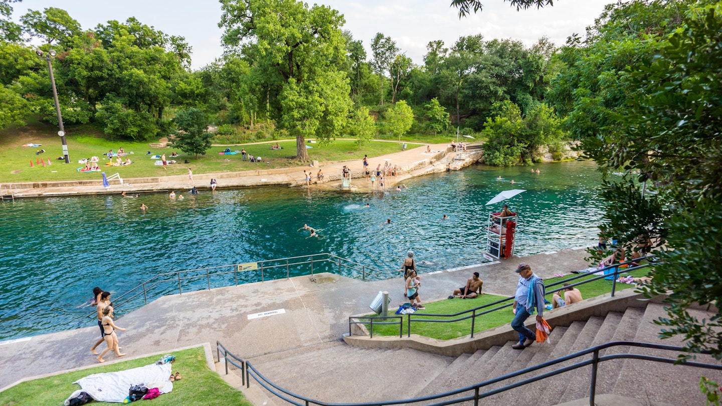 JULY 2017: Visitors enjoy the natural water of Barton Springs pool in Austin.