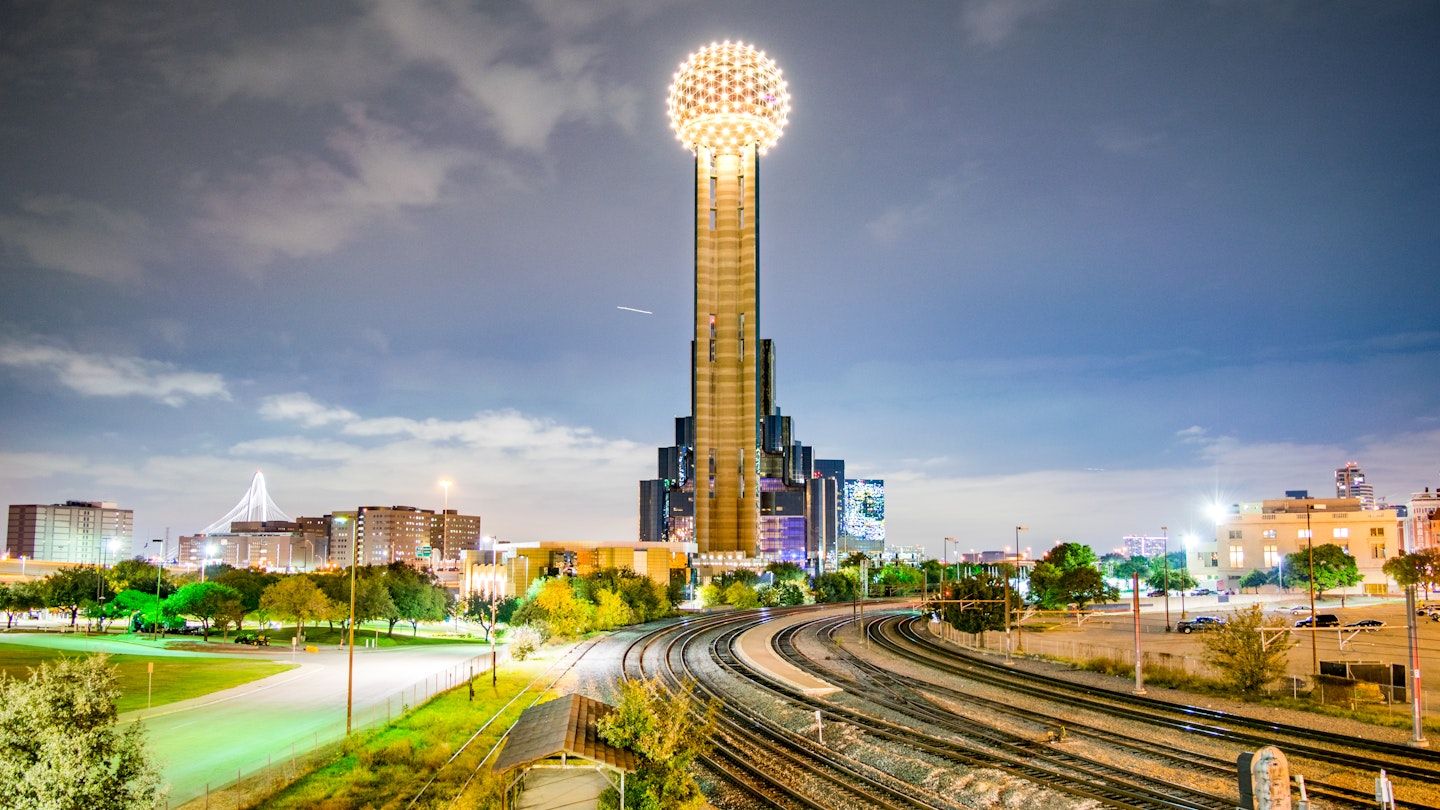 Iconic Observation Tower, Railroad Tracks and City Park at Night - Dallas, Texas, USA ;