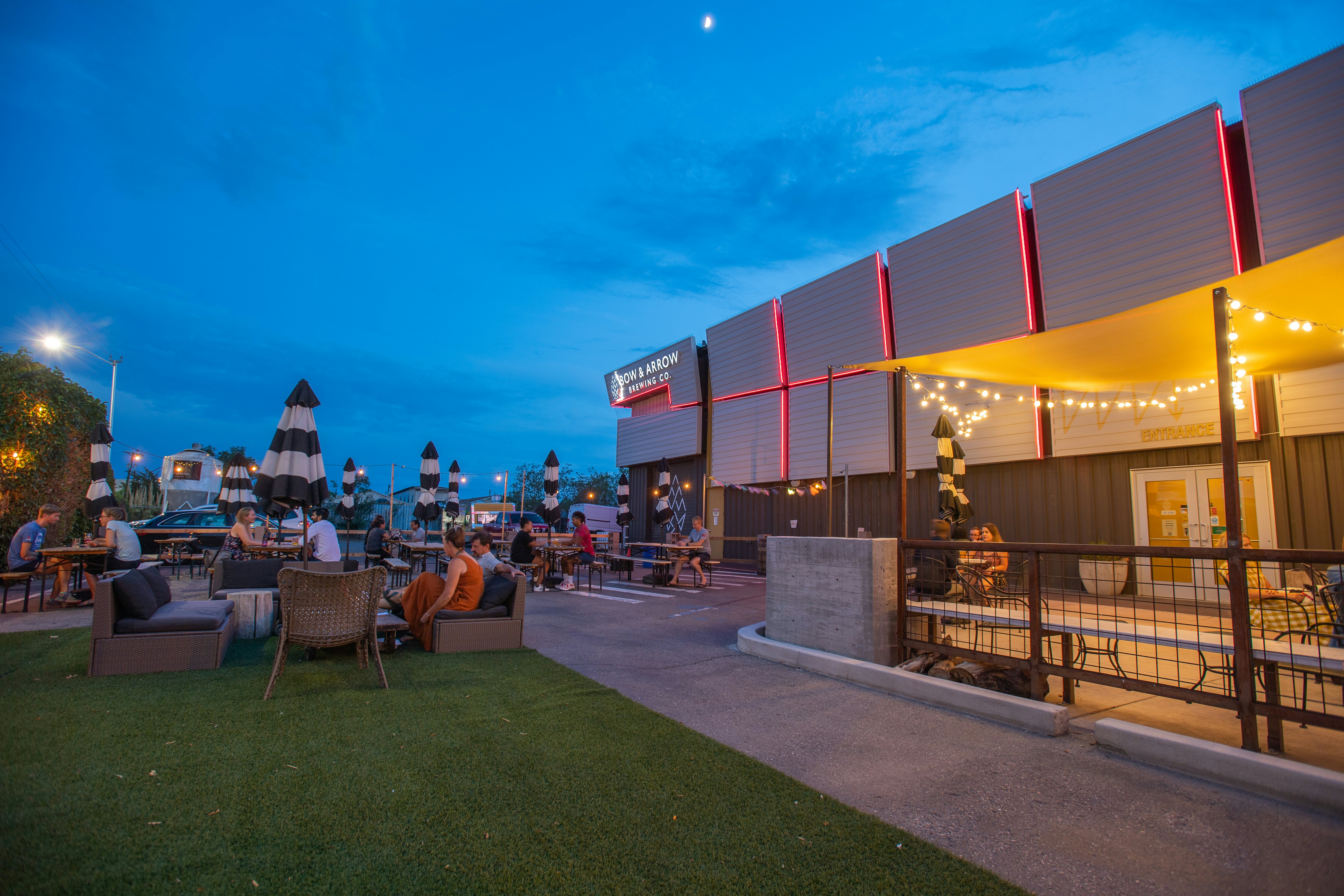 Albuquerque visitors drink beer on a brewery patio