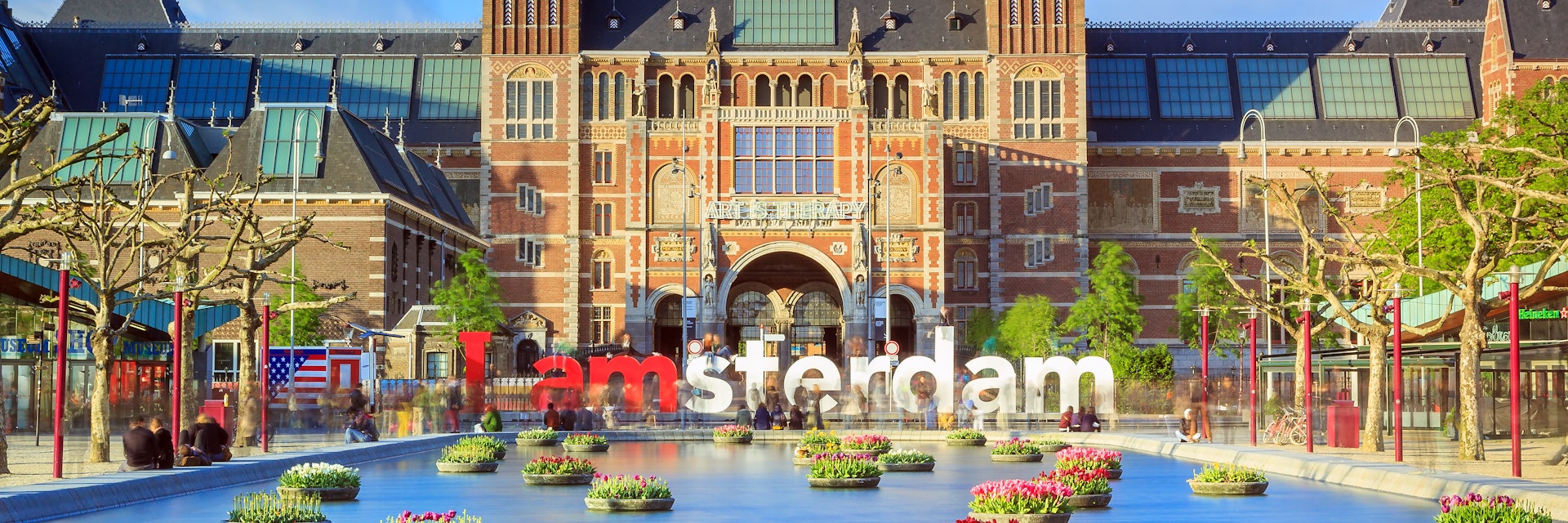 Rijksmuseum with tulips in Amsterdam..NOTE: dated image - "iamamsterdam" sign has been removed from outside museum.