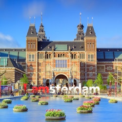 Rijksmuseum with tulips in Amsterdam..NOTE: dated image - "iamamsterdam" sign has been removed from outside museum.