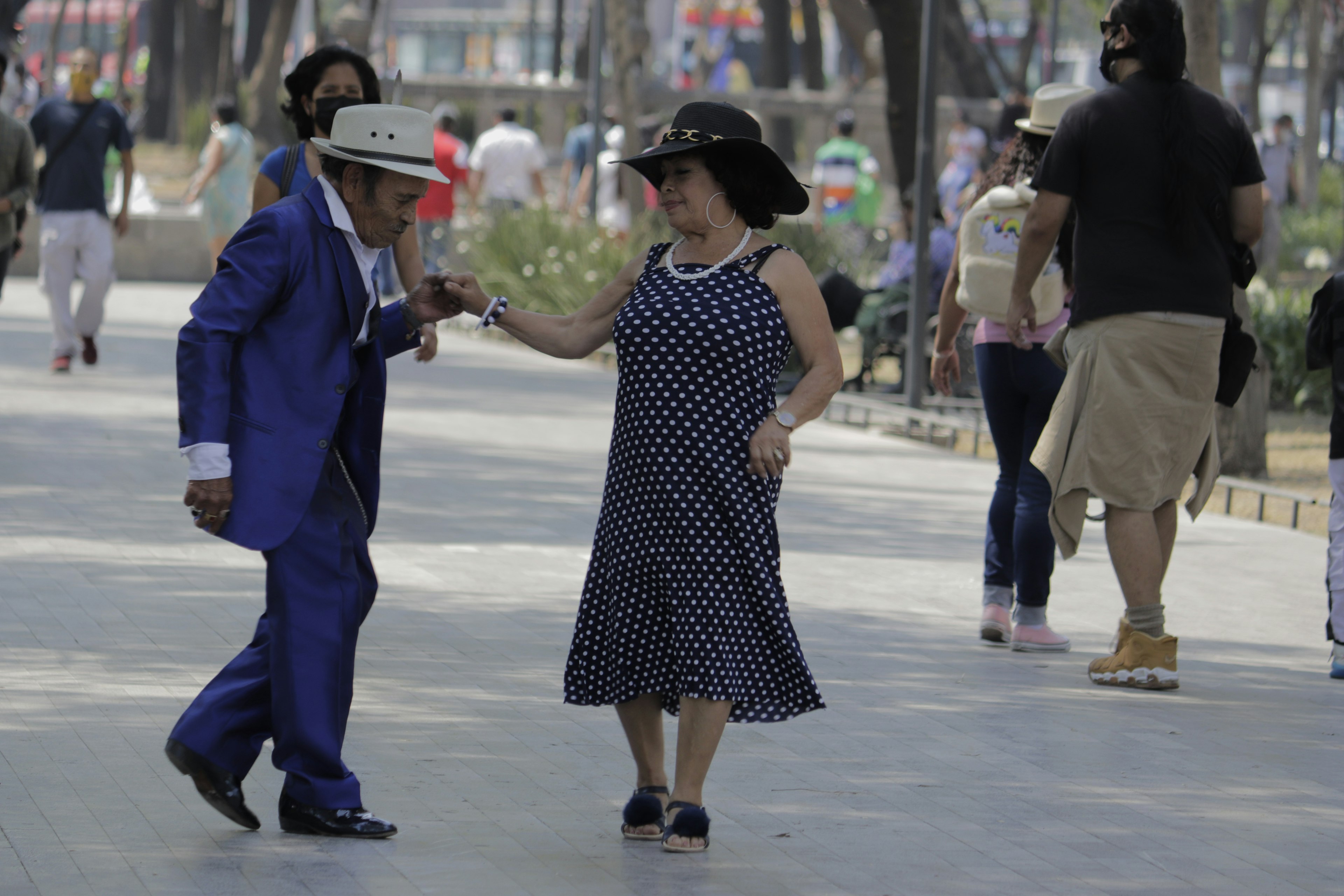 An older couple dances in the street of Alameda Central in Mexico City, Mexico