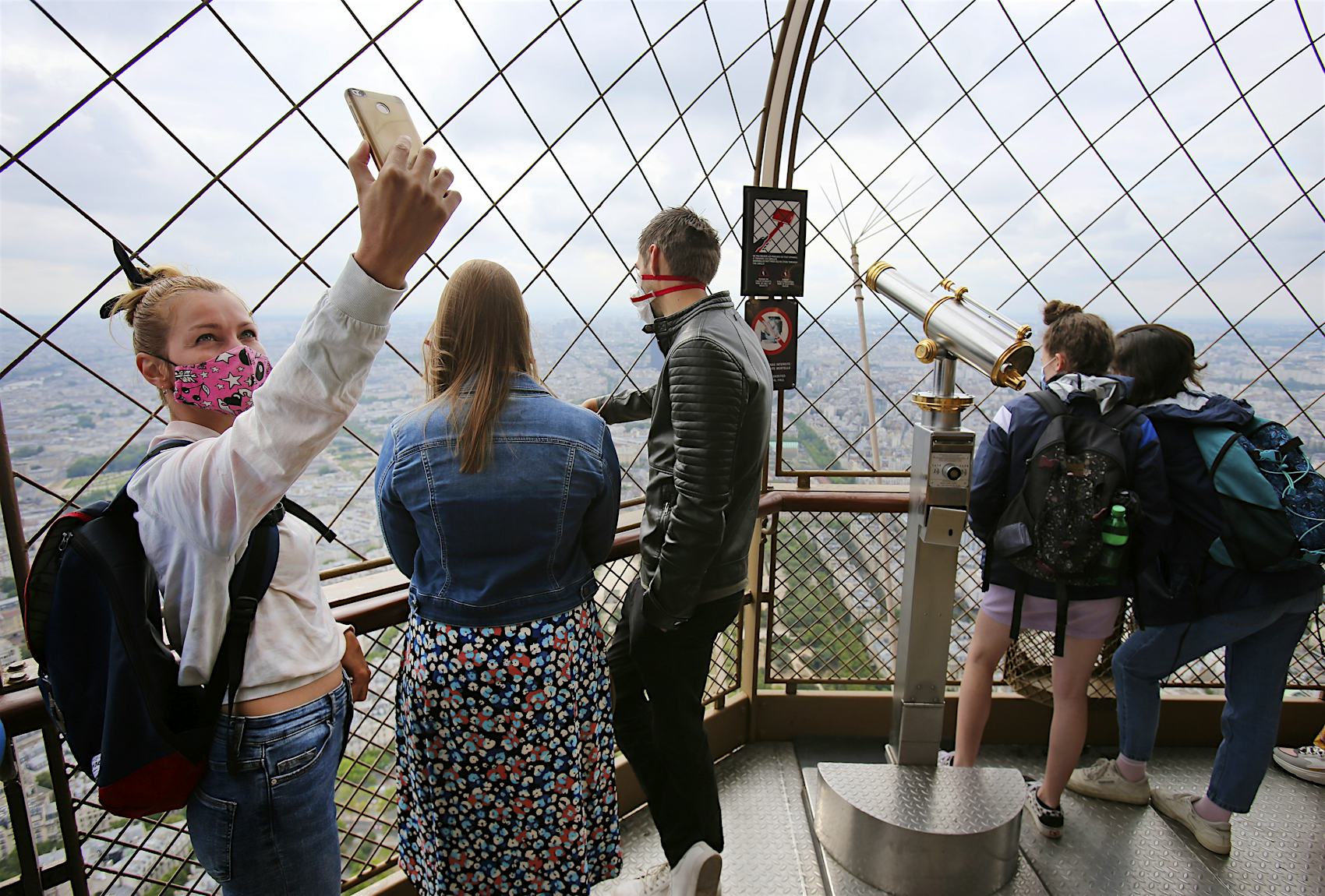 Visitors to the Eiffel Tower as it reopened on July 15 after months of closure 