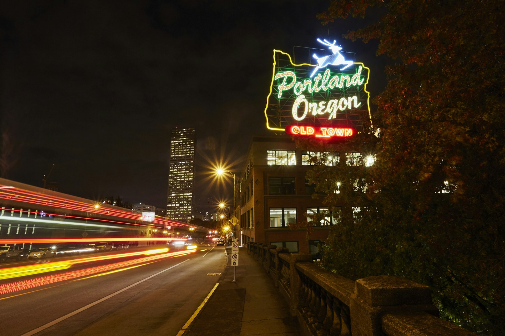 Neon sign with blurred traffic passing by in Portland, Oregon