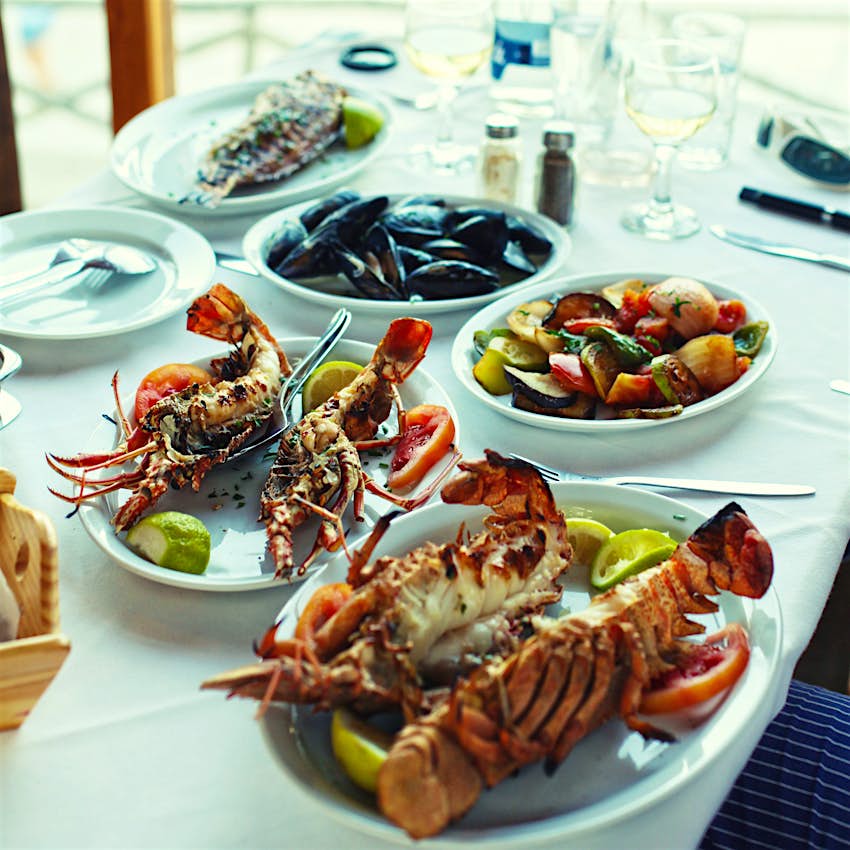 Lobster and vegetables in typical greek taverna, Crete