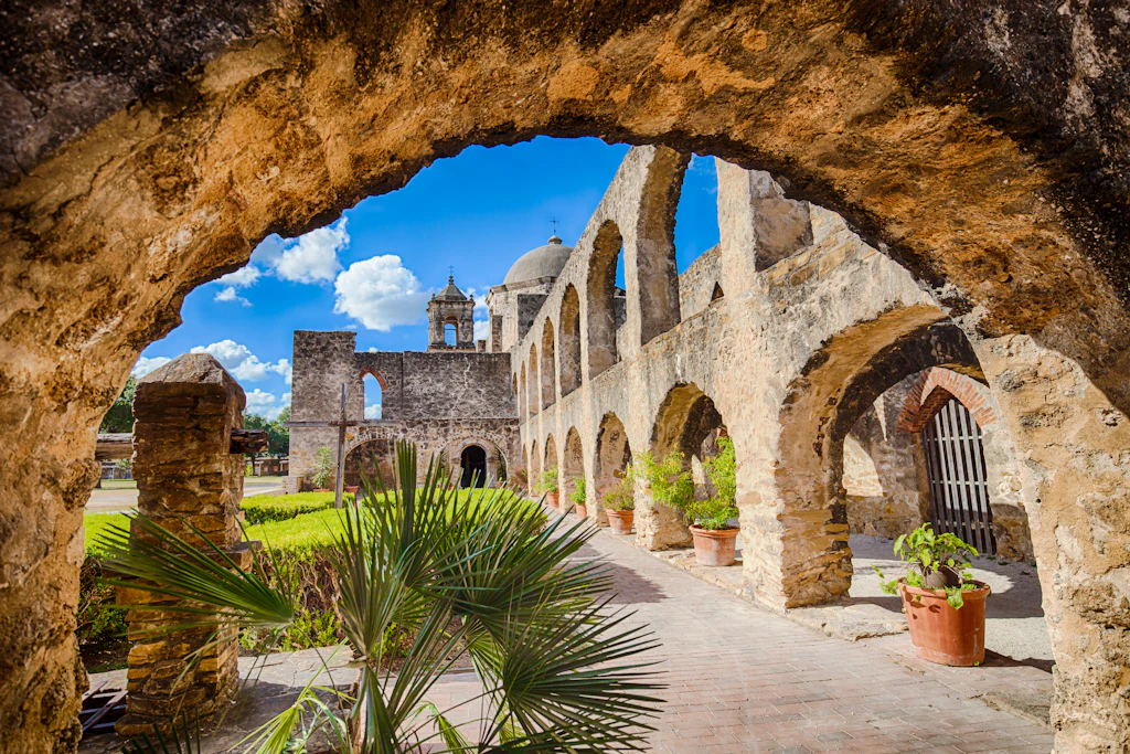 An archway leading through to gardens and another series of arches