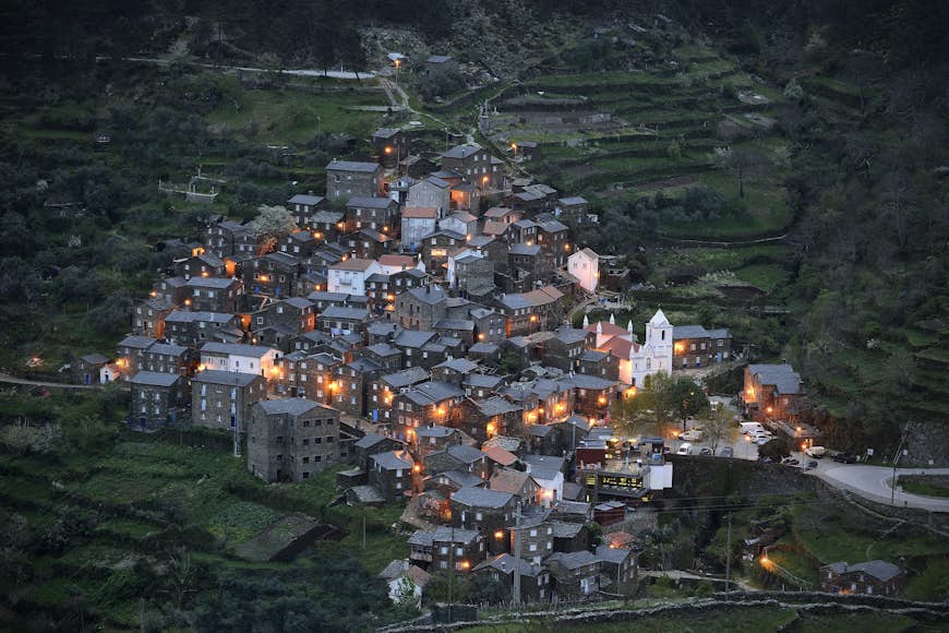 The village of Piódão in Portugal. The rural mountain village is built on a steep slope, and consists of a number of traditional stone houses.