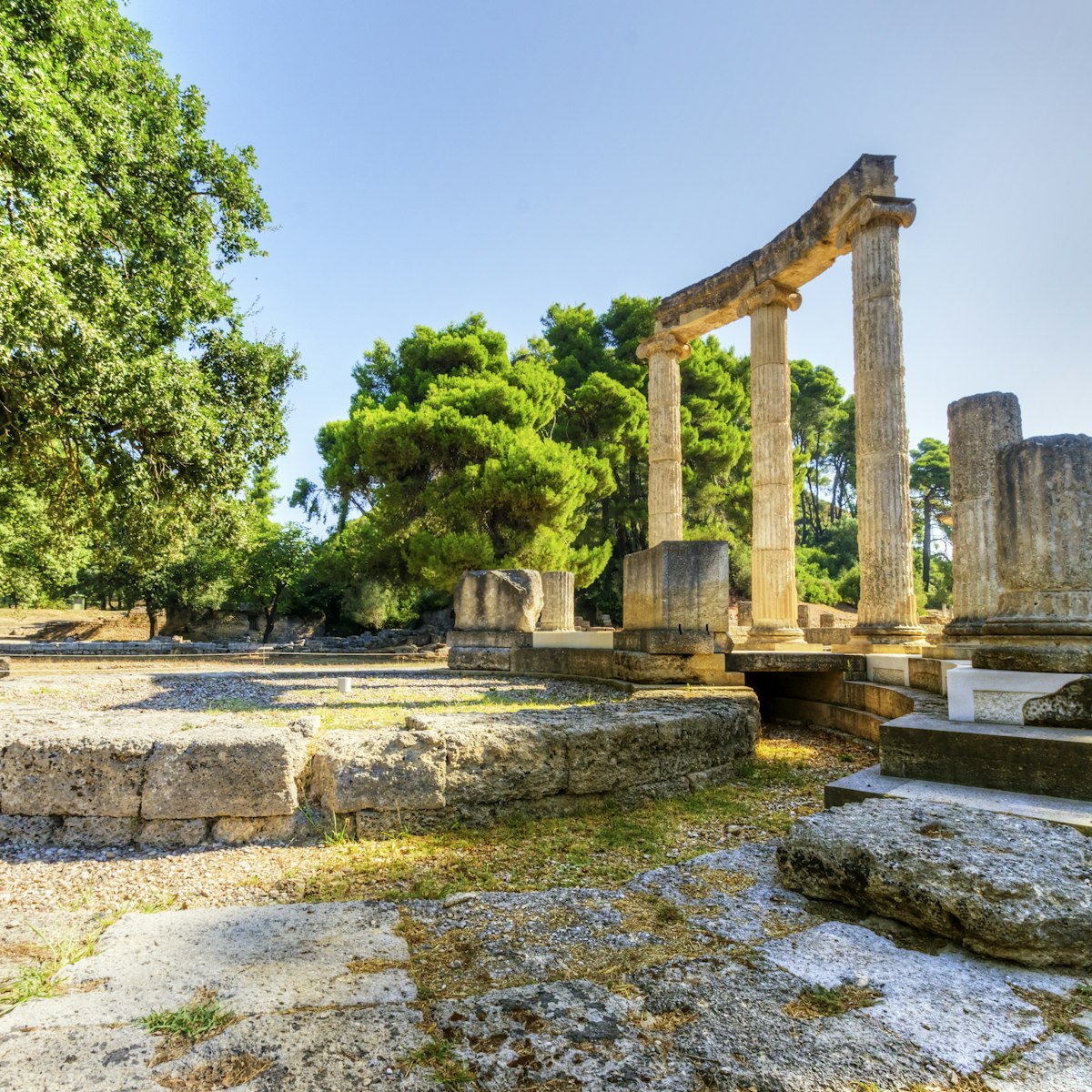 Ruins of the ancient site of Olympia, specifically the Philippeion in the Altis of Olympia, which was an Ionic circular memorial of ivory and gold. The Olympic games originate from there.