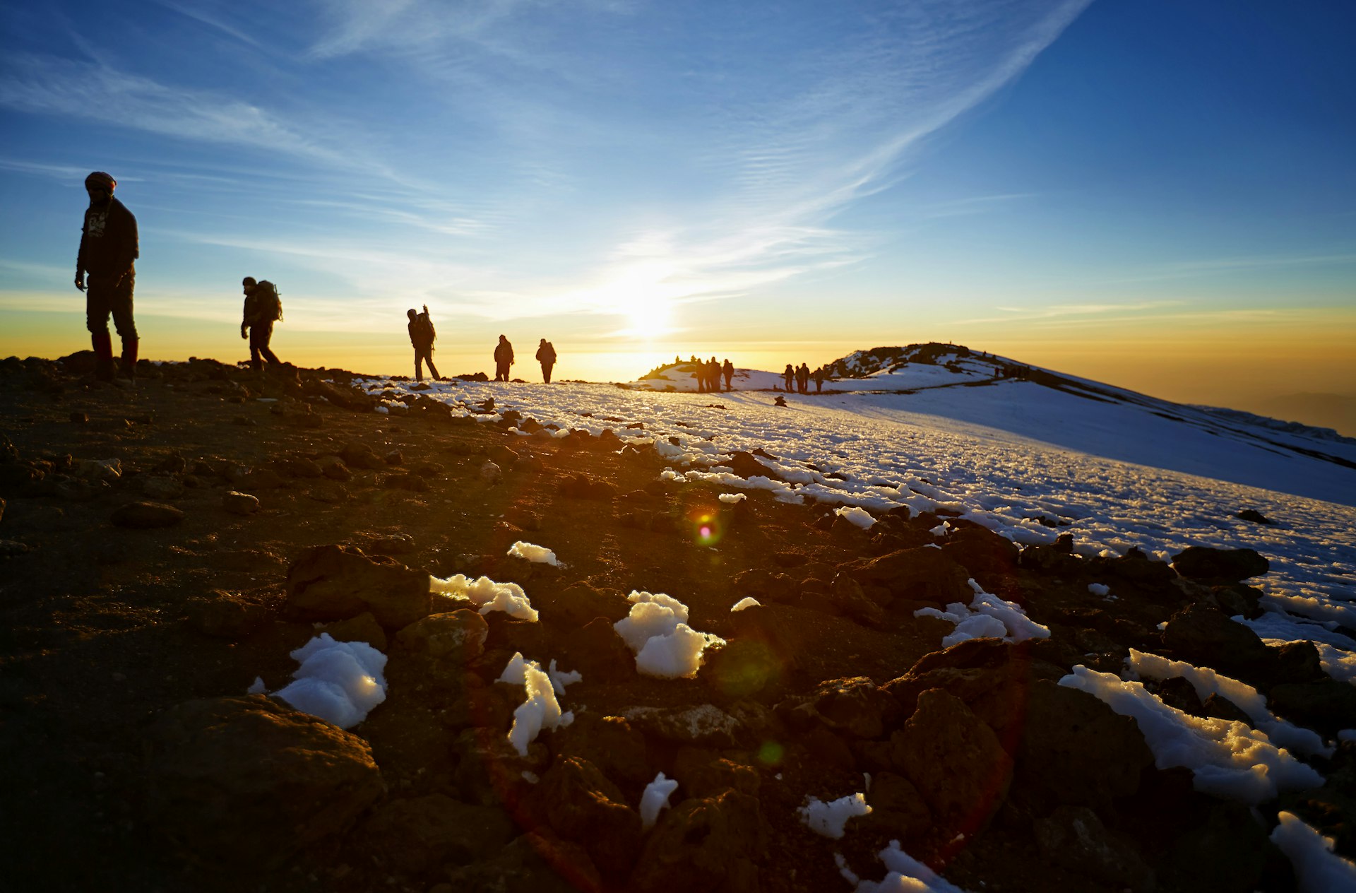 People climb the last stretch to the top of Mt Kilimanjaro en route to the summit
