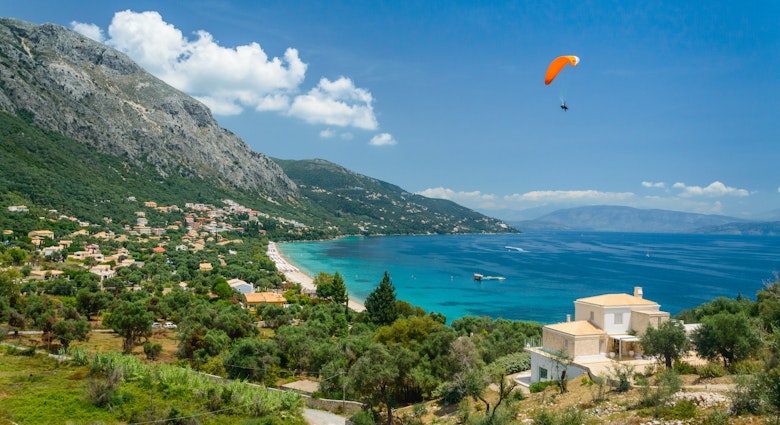 The strong northern wind and incredible views make Greek islands like Corfu great for paragliding. 
