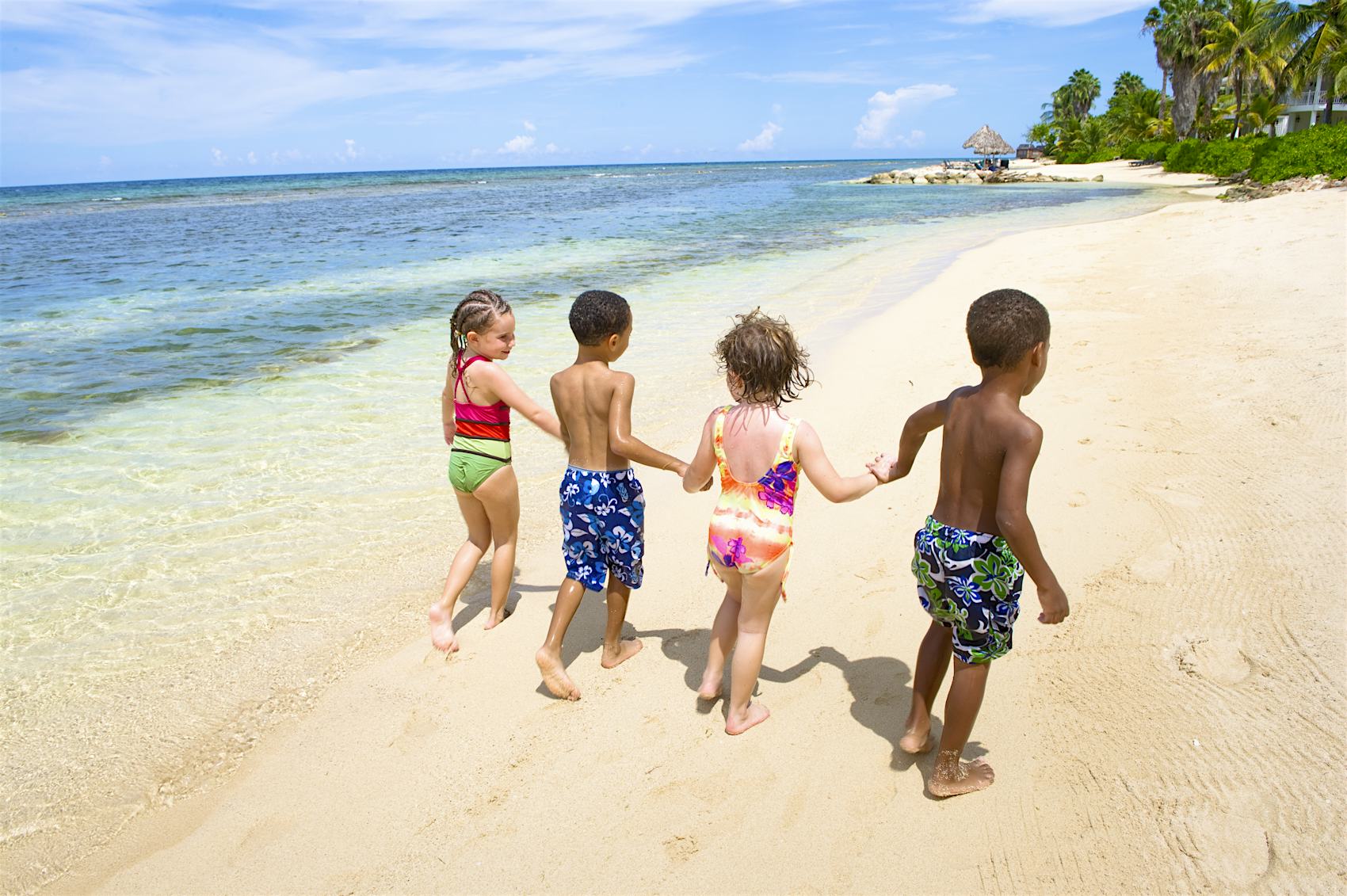 Montego Bay, Jamaica. Children playing together at the Half Moon Resort beach.