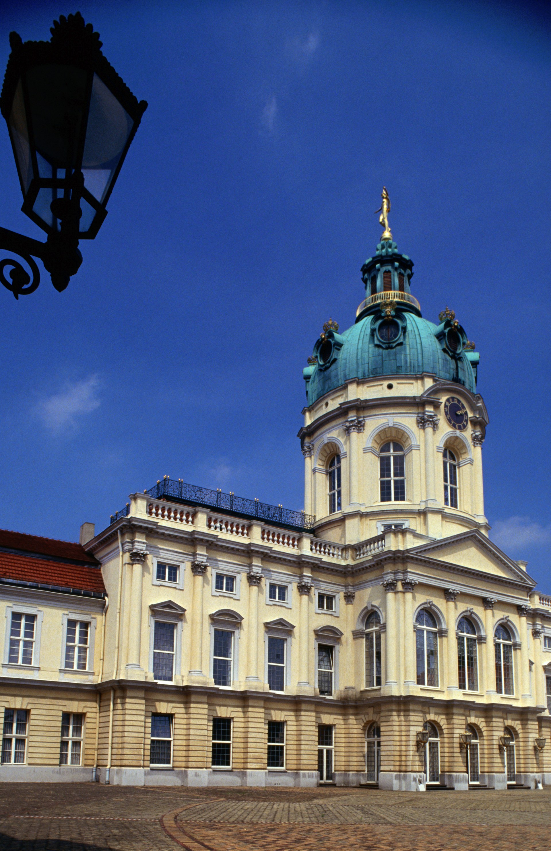 An external view of Schloss Charlottenburg with clear blue skies above it