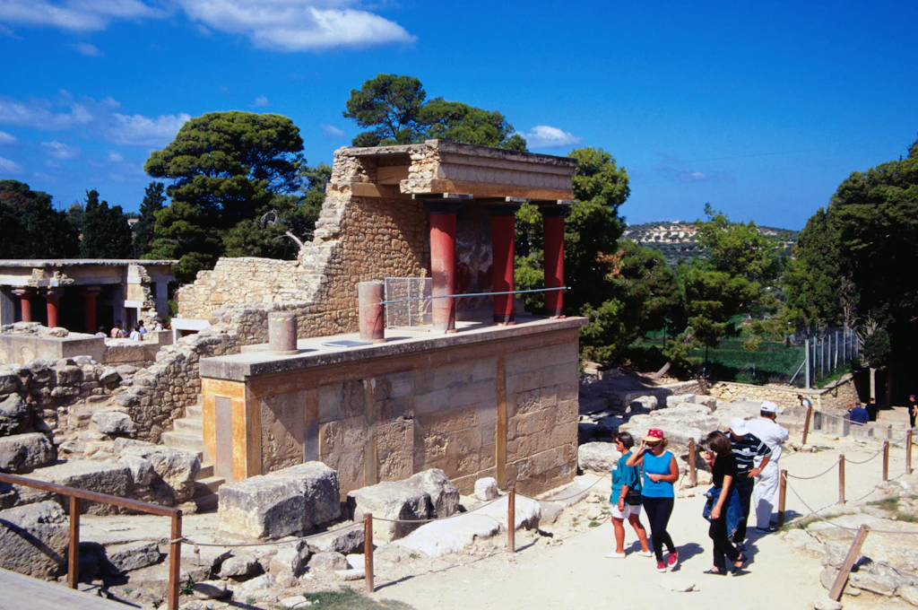 LPI-1947-34.jpg A group of people walk past the ruins of the Palace of Knossos, in Crete, Greece.