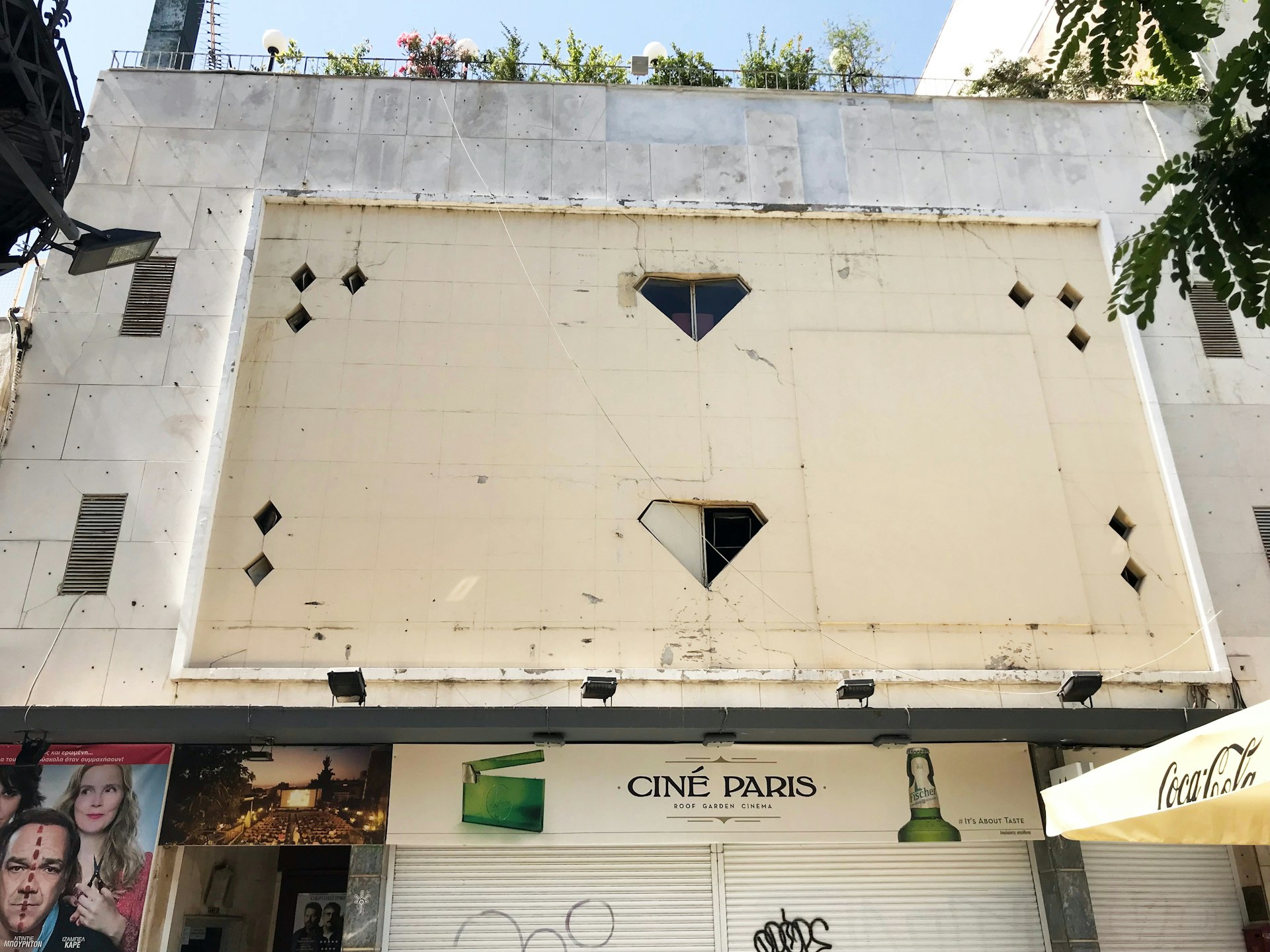 The entrance to Cine Paris in Plaka neighbourhood is a white, non-descript one