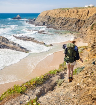 hiker on hiking trail  along coast portugal , rota vicentina. HDR image
