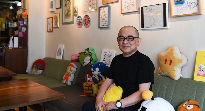Toru Hashimoto sits inside 84, a secret café for Nintendo fans, in Tokyo, Japan, on Thursday, June 24, 2021. Tucked away at the back of a nondescript building in the hip Shibuya district, the establishment named 84 is the brainchild of a former Nintendo Co. employee Hashimoto, who initially conceived it as a sanctuary for game developers to nerd out and relax. Photographer: Noriko Hayashi/Bloomberg via Getty Images