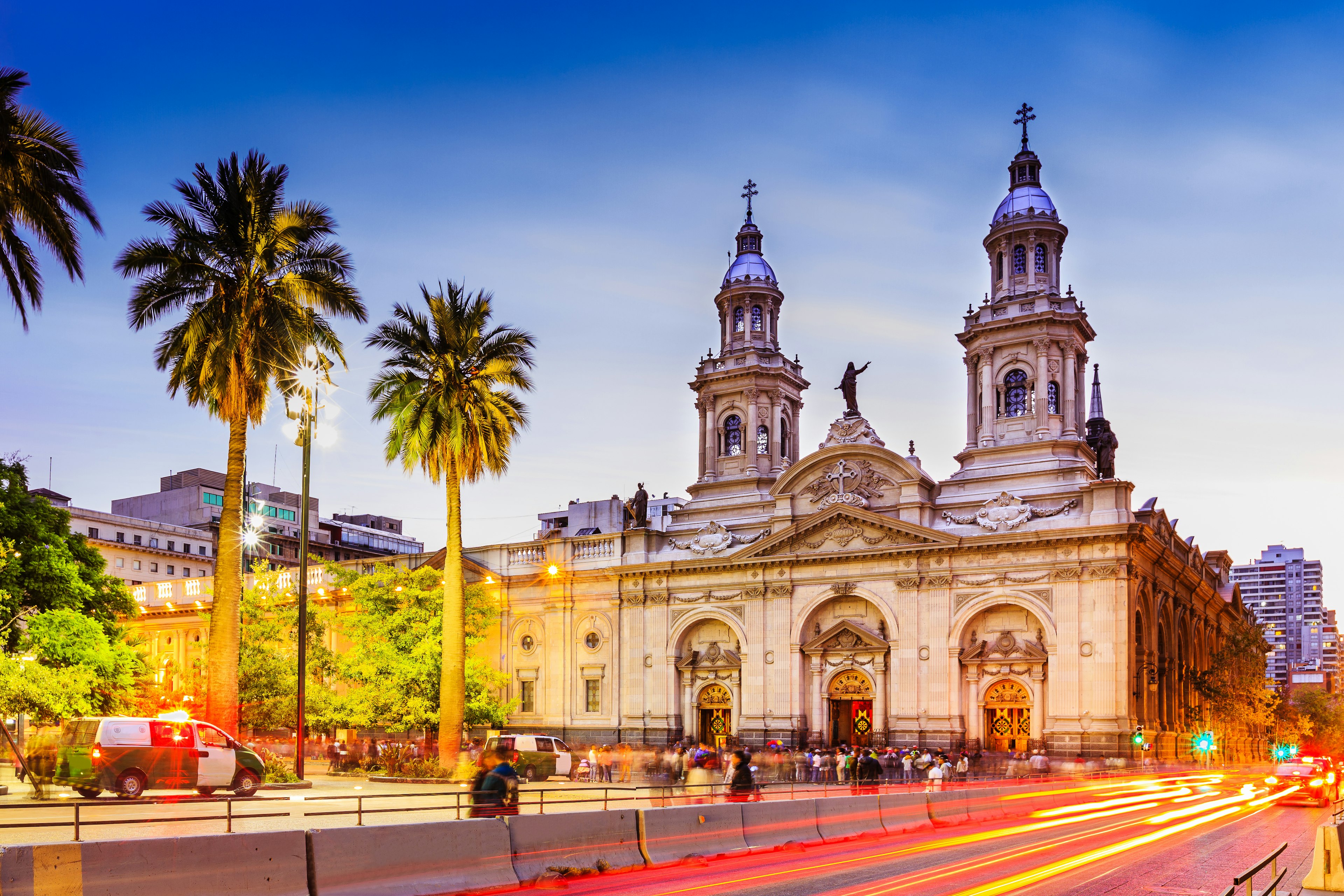 Long exposure of passing traffic and pedestrians at Plaza de Armas, Santiago in Chile.