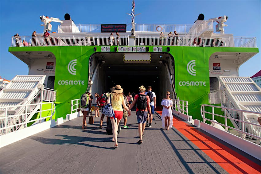 Tourists boarding the ferry to Santorini island at the port of Heraklion