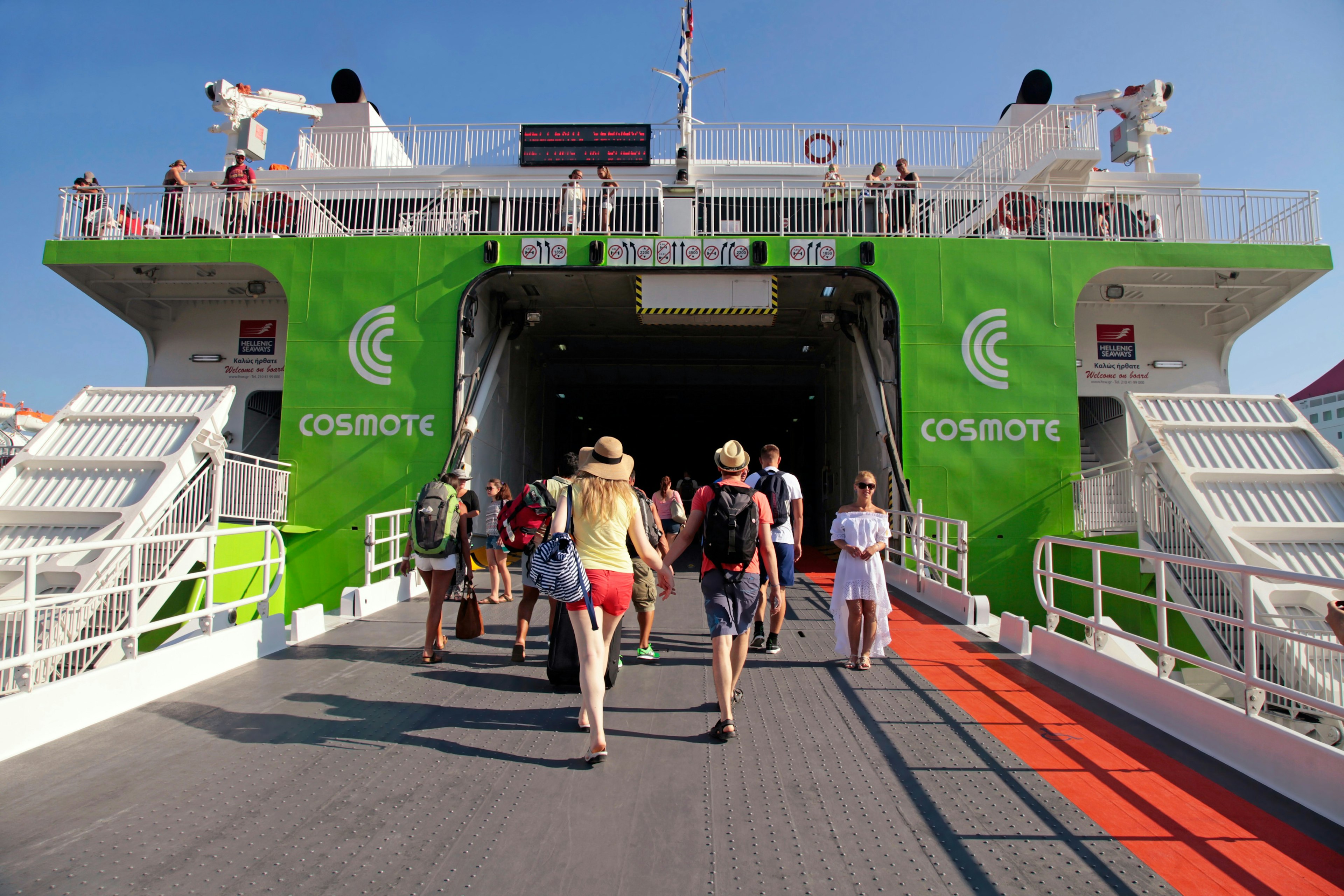 Tourists boarding the ferry to Santorini island at the port of Heraklion