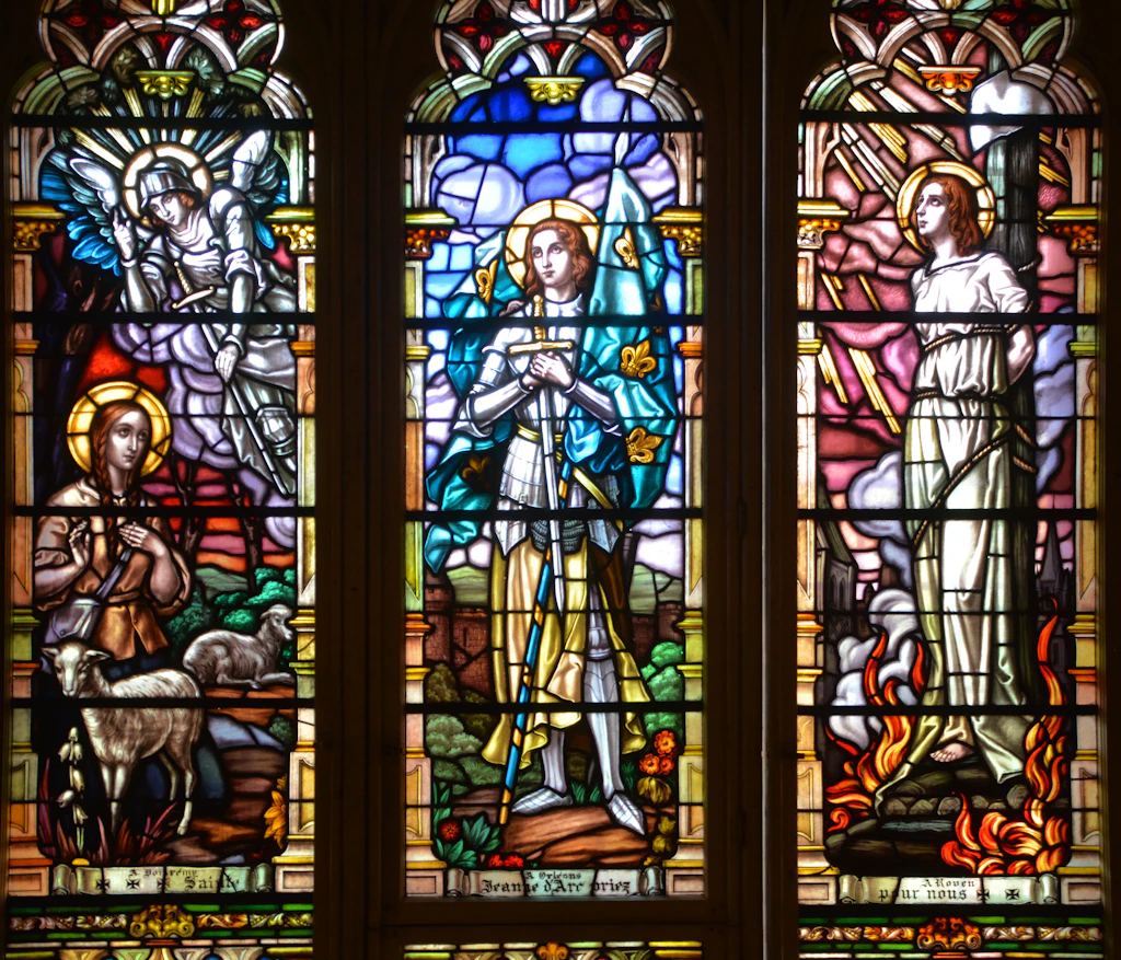 Stained glass window inside Notre-Dame Basilica Stained glass windows showing saintly figures