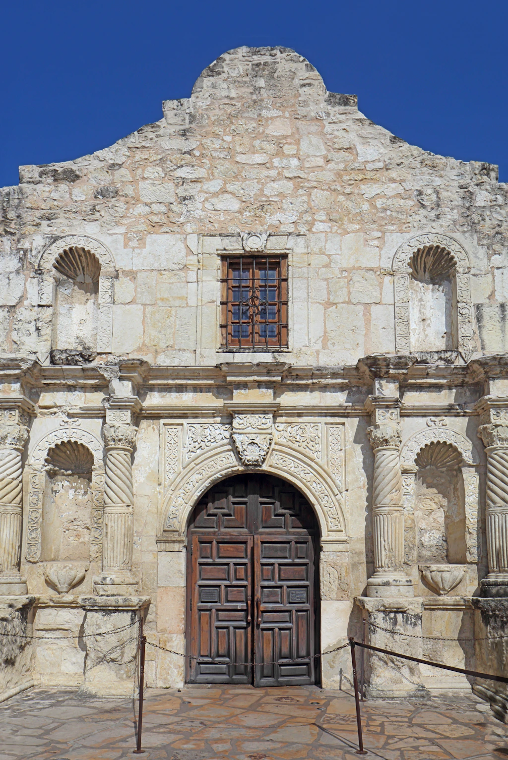 The facade of a white Spanish-style colonial church building