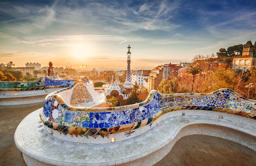 Colorful mosaics on a seat at Park Güell at sunrise in Barcelona, Spain