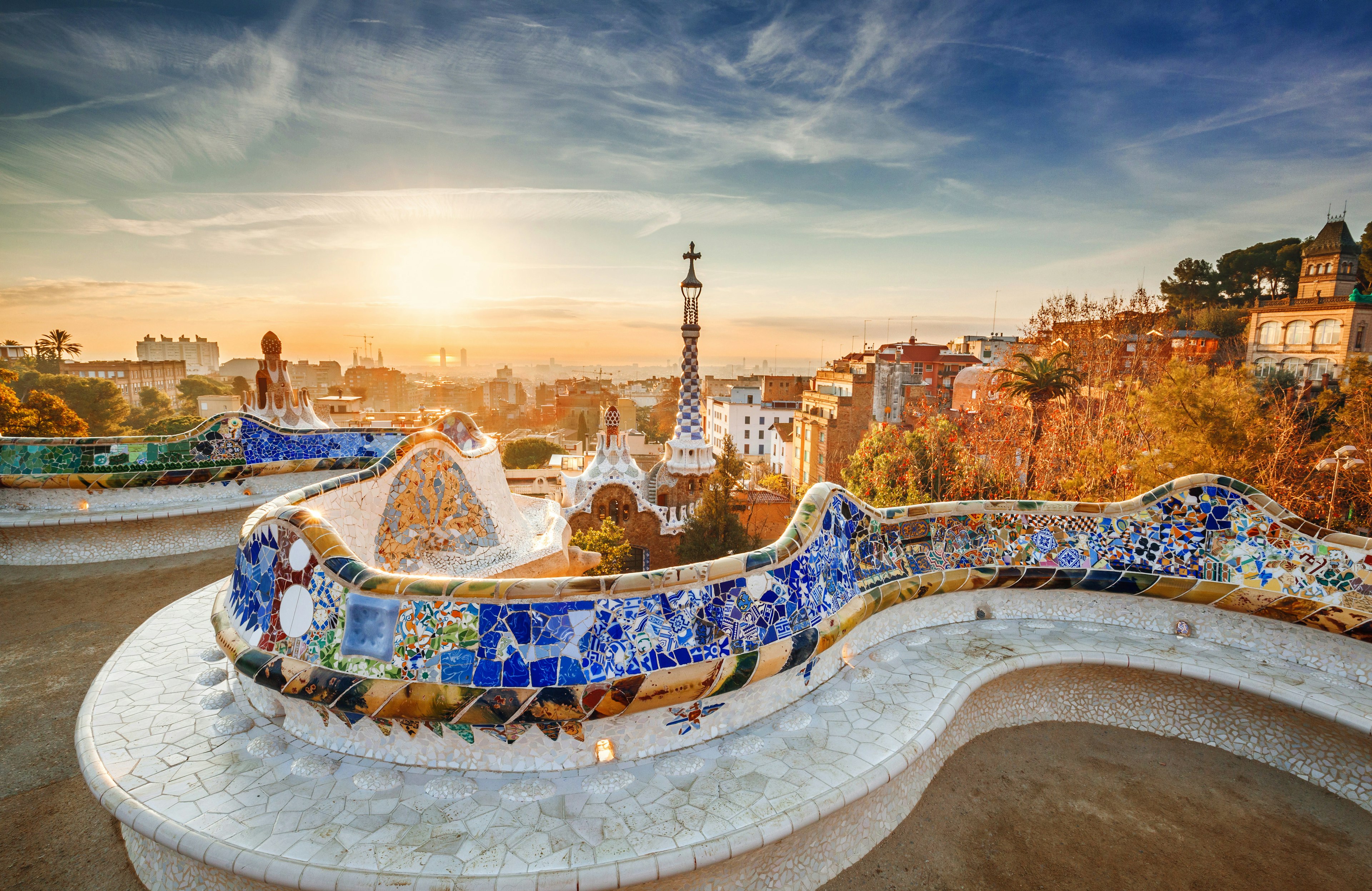 Colorful mosaics on a seat at Park Güell at sunrise in Barcelona, Spain