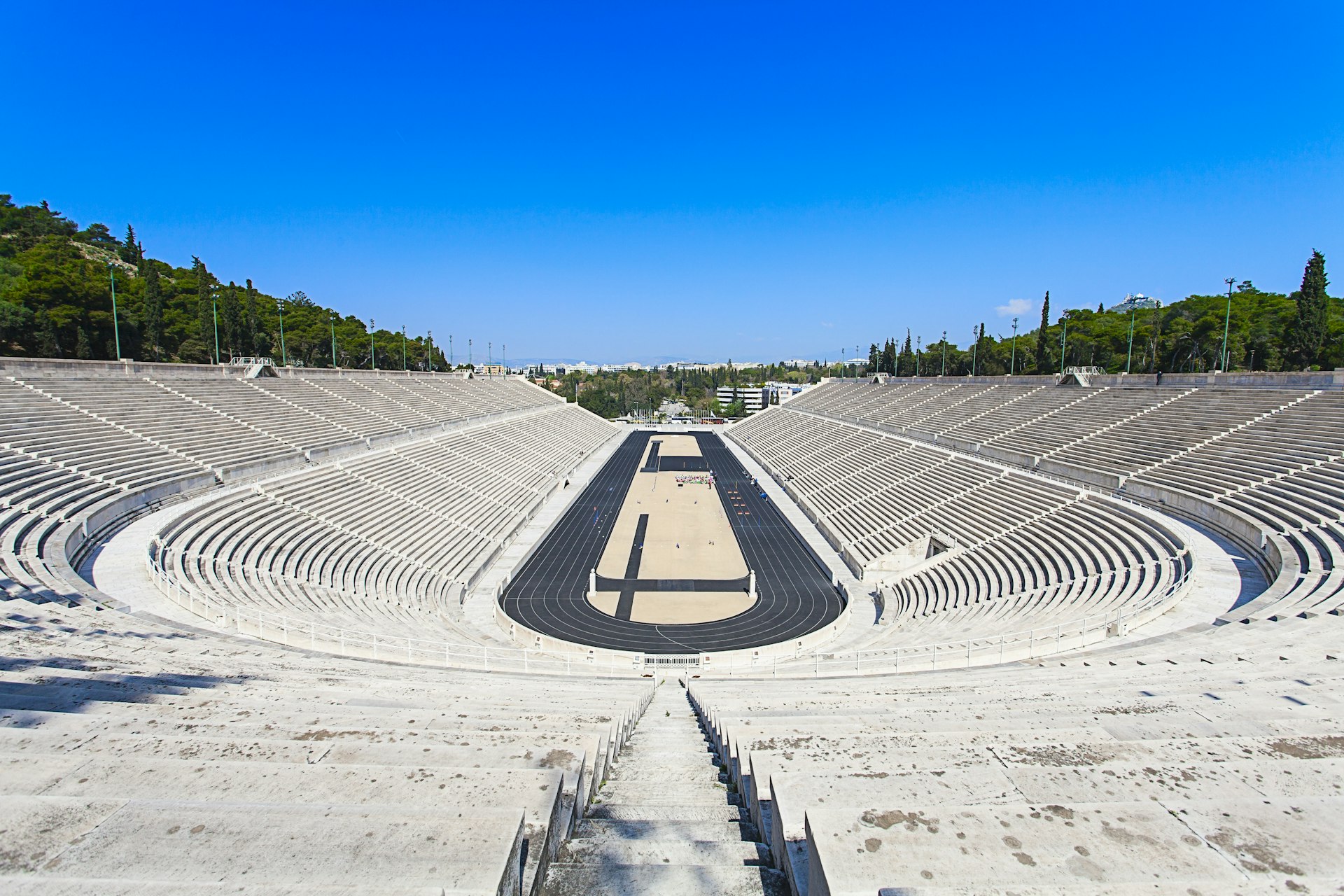 An empty Panathenaic Stadium as seen from the top of the seats in Athens, Greece on a sunny day