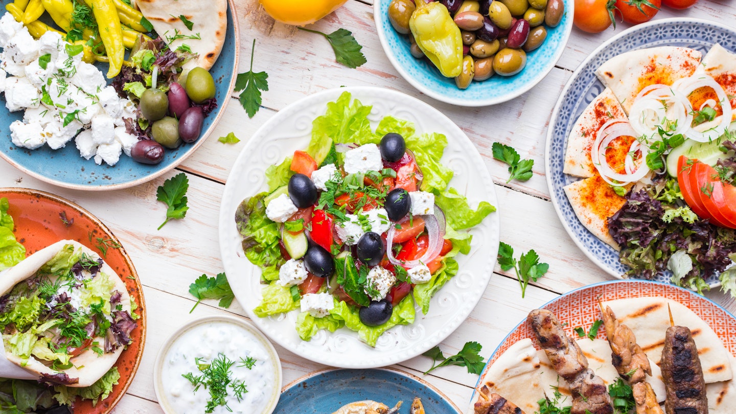 Greek cuisine features grilled skewered meat, cheese, olives, seafood, pitas, and more.