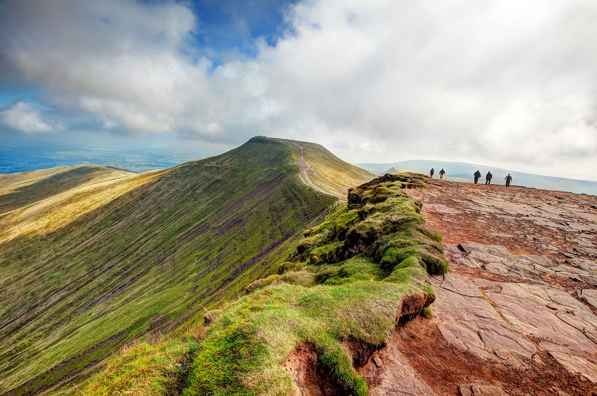 Walkers on the summit of Corn Du in Brecon Beacons National Park, Wales