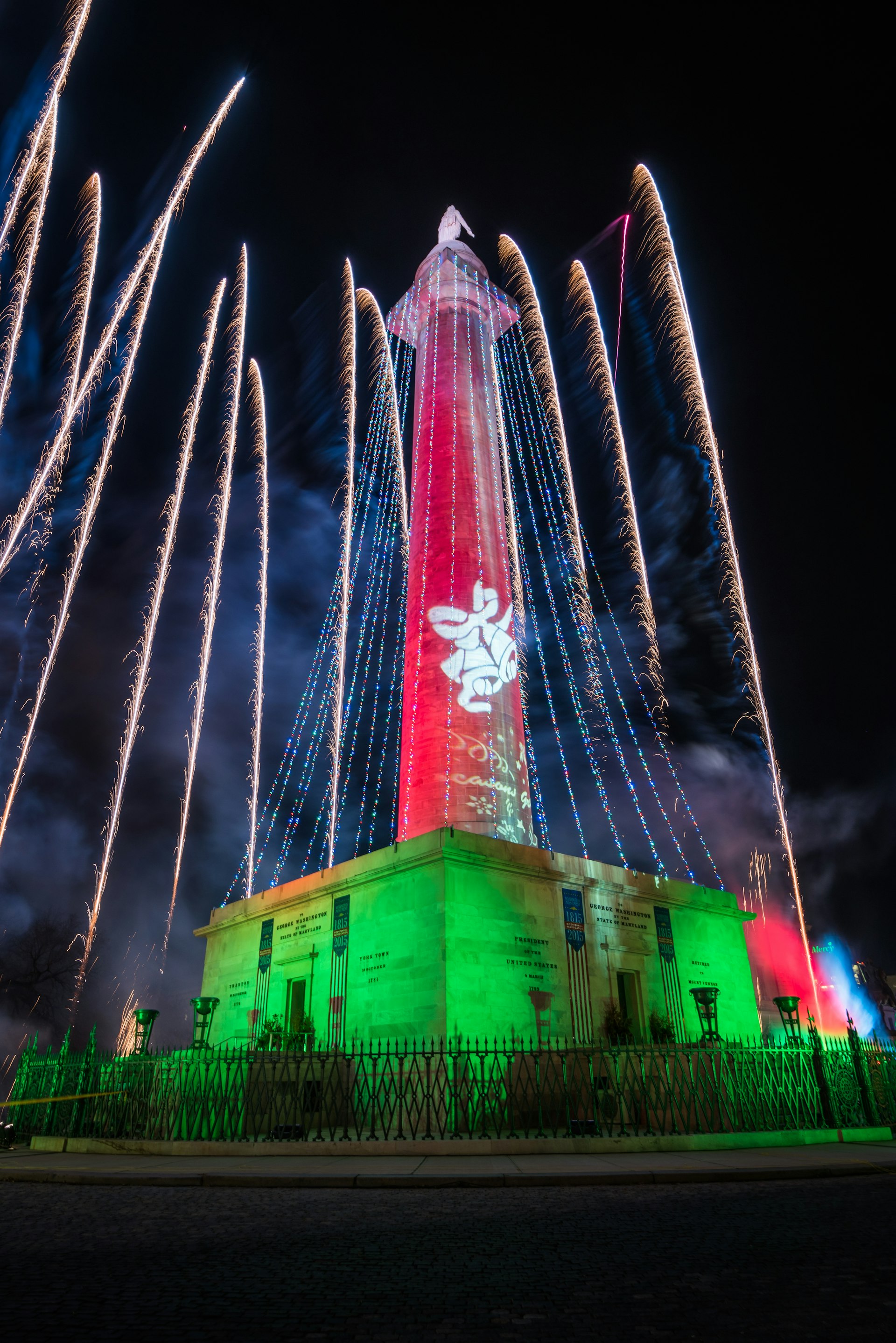 Fireworks over the Washington Monument at Christmas Monument Lighting in Mount Vernon, Baltimore, Maryland