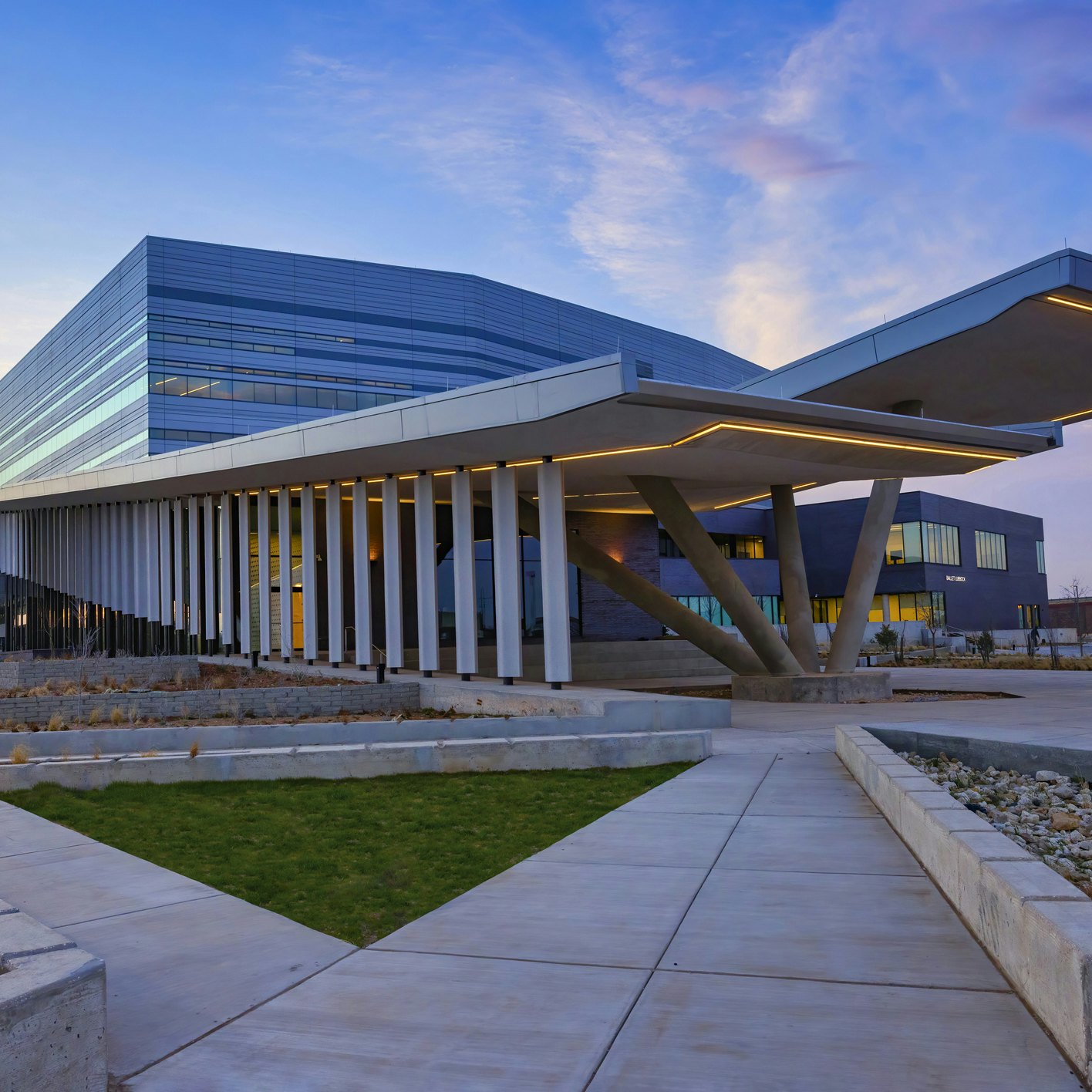 Buddy Holly, Buddy Holly Hall of Performing Arts and Sciences, Lubbock, Texas, view of eastern elevation. Premier location for musical performances, including symphony orchestra, concerts, bands. Two auditoriums provide world class acoustics. Helen Devitt Jones Auditorium seats 2,200, and Crickets Studio Theater seats 425. Rave On Restaurant is located in the facility. Ballet Lubbock Pre-Professional facilities. Locations for receptions, banquets, lectures, meetings, and rehearsals.