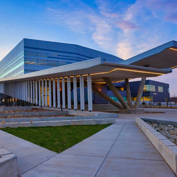 Buddy Holly, Buddy Holly Hall of Performing Arts and Sciences, Lubbock, Texas, view of eastern elevation. Premier location for musical performances, including symphony orchestra, concerts, bands. Two auditoriums provide world class acoustics. Helen Devitt Jones Auditorium seats 2,200, and Crickets Studio Theater seats 425. Rave On Restaurant is located in the facility. Ballet Lubbock Pre-Professional facilities. Locations for receptions, banquets, lectures, meetings, and rehearsals.