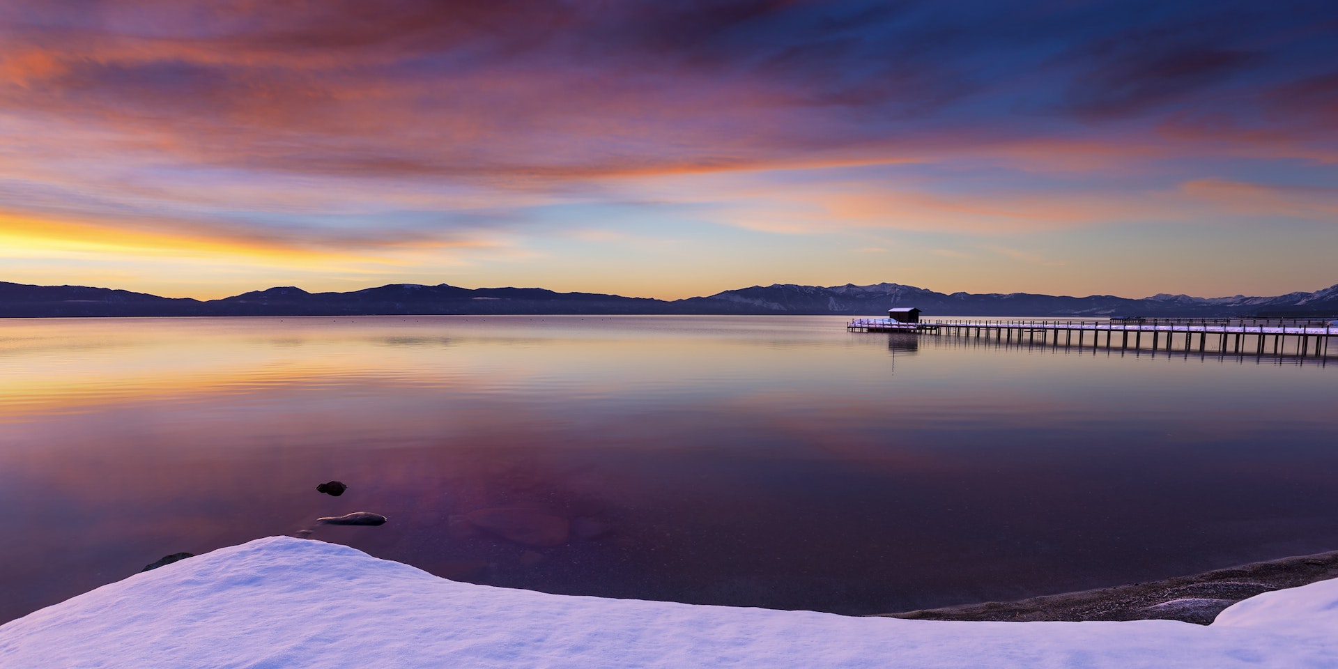 Early morning winter sunrise at Commons Beach in Tahoe City, California, Lake Tahoe.