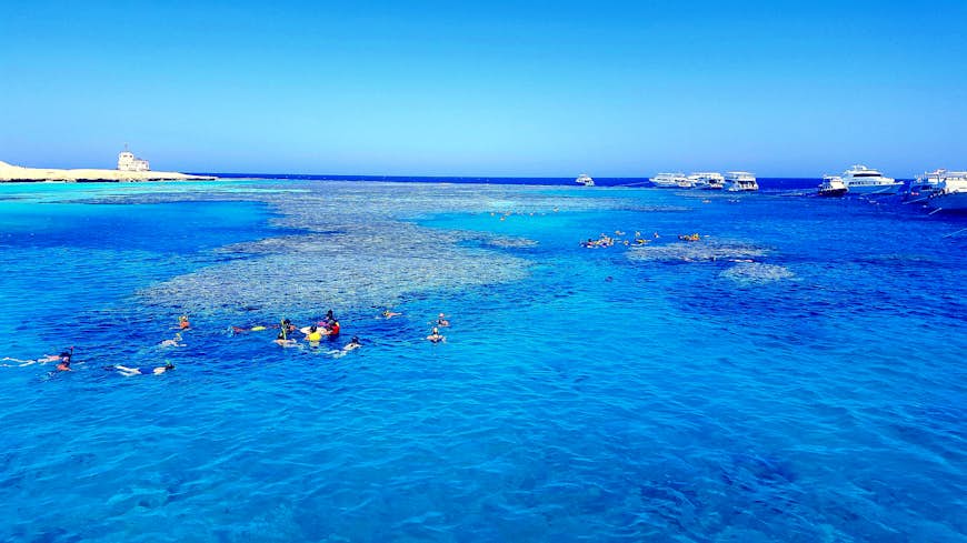 Swimmers along the coast in Hurghada, Egypt