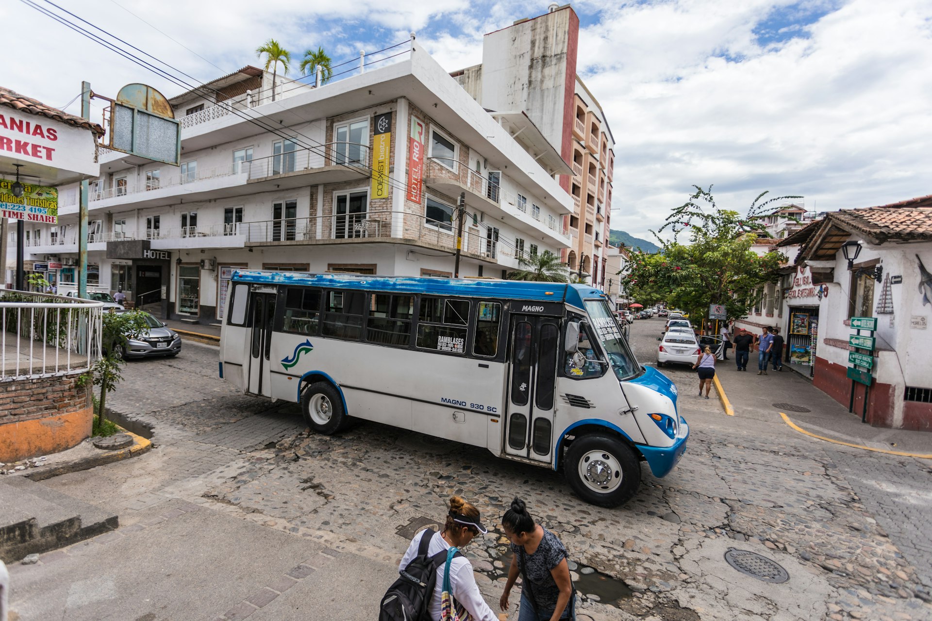 A public bus driving through the downtown district of Puerto Vallarta