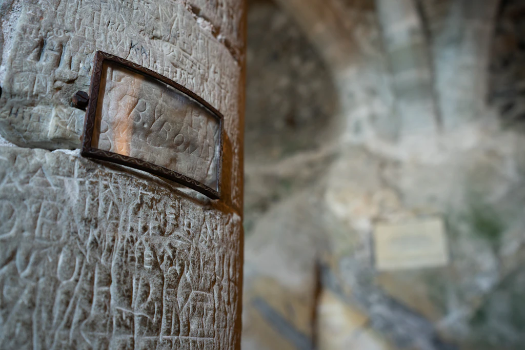 200 years old carved signature of the English writer Lord Byron in the dungeon prison of Chillon castle in Switzerland The supposed signature of Lord Byron carved into a wooden beam in the prison of Chillon Castle in Switzerland. The carving has been protected by a plastic screen.