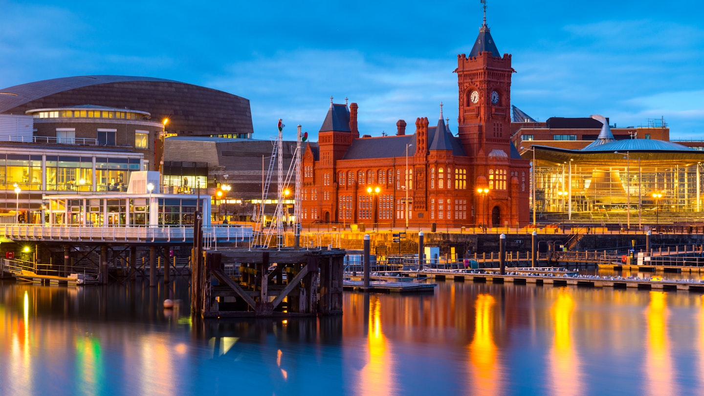 Cardiff Bay at dusk, the Pierhead building (1897) and National Assembly for Wales can be seen over the water.