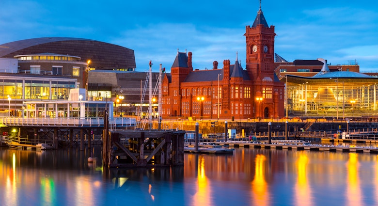Cardiff Bay at dusk, the Pierhead building (1897) and National Assembly for Wales can be seen over the water.