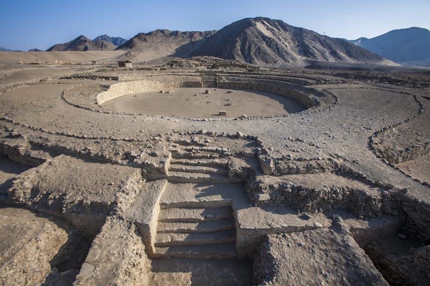 Ruins of Caral, Peru, with mountains in the background