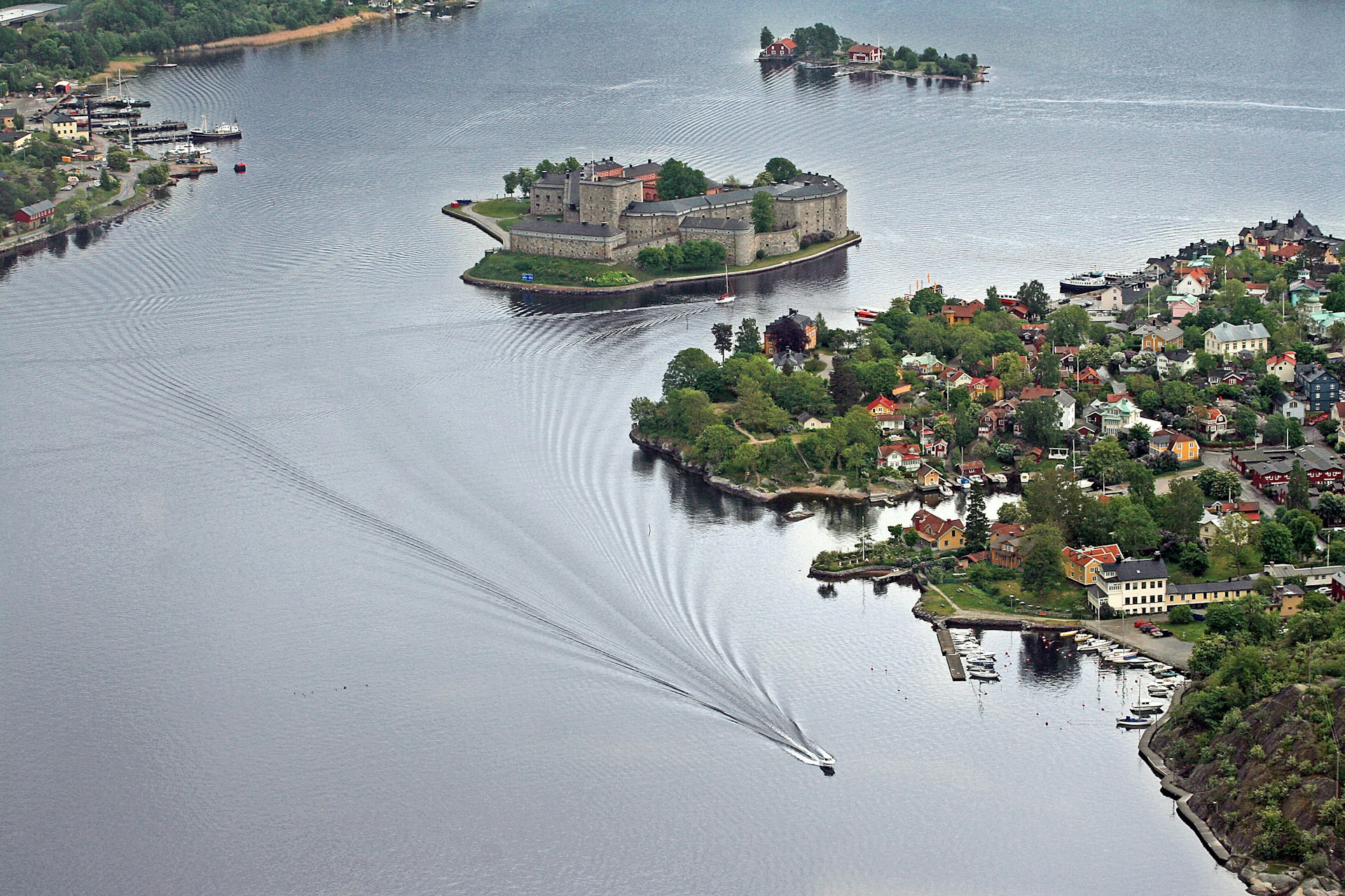 An aerial shot of a series of built-up islands in a body of water